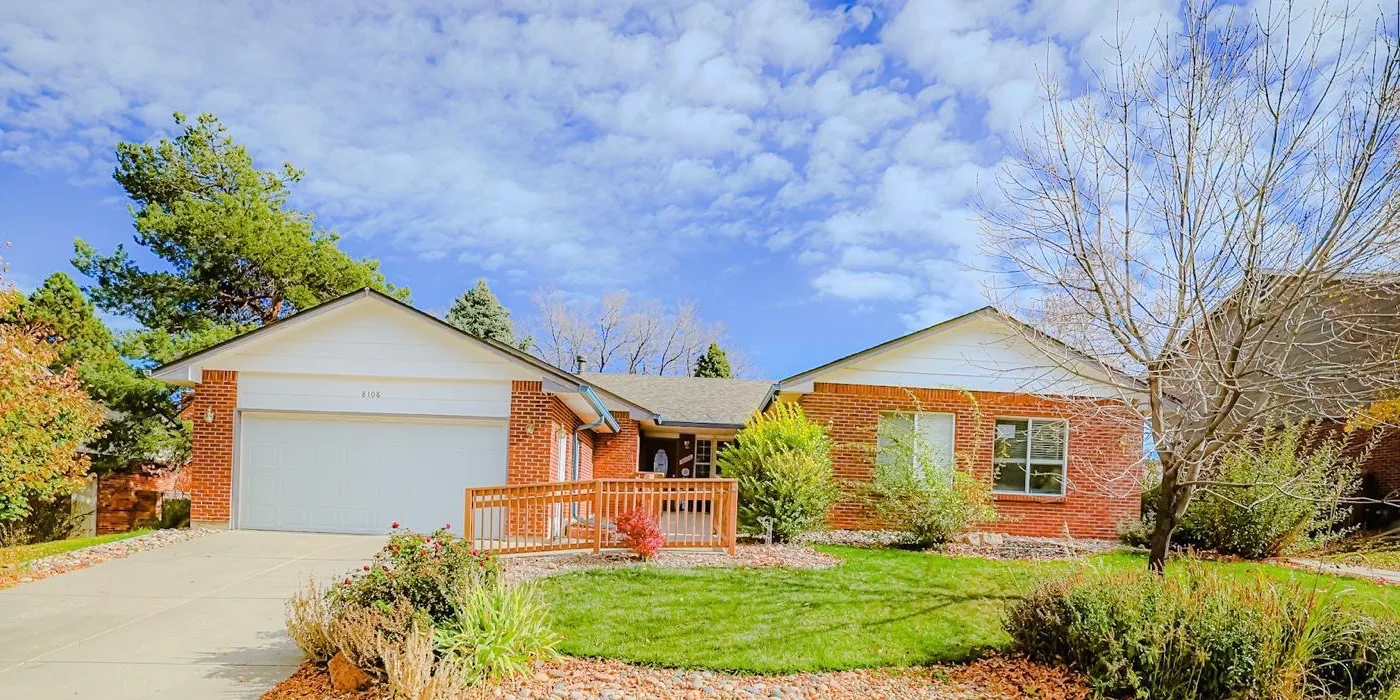 Rose Assisted Living brick home with a broad front lawn